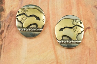Sterling Silver Buffalo with Heartline Design Post Earrings with 12K Gold fill. Created by Navajo Artist Tommy Singer. Signed by the Artist.